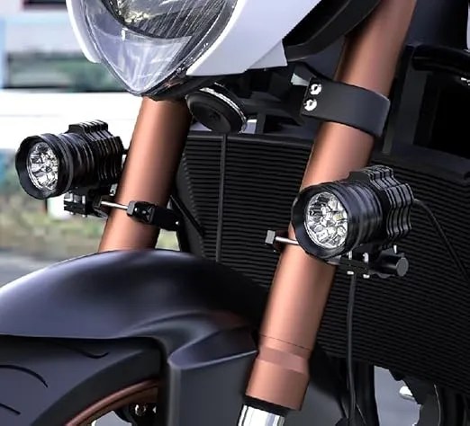 High-quality motorcycle front suspension with LED auxiliary lights and modern design, ideal for urban commuting and touring on Indian roads, showcased by Ride India Ride.